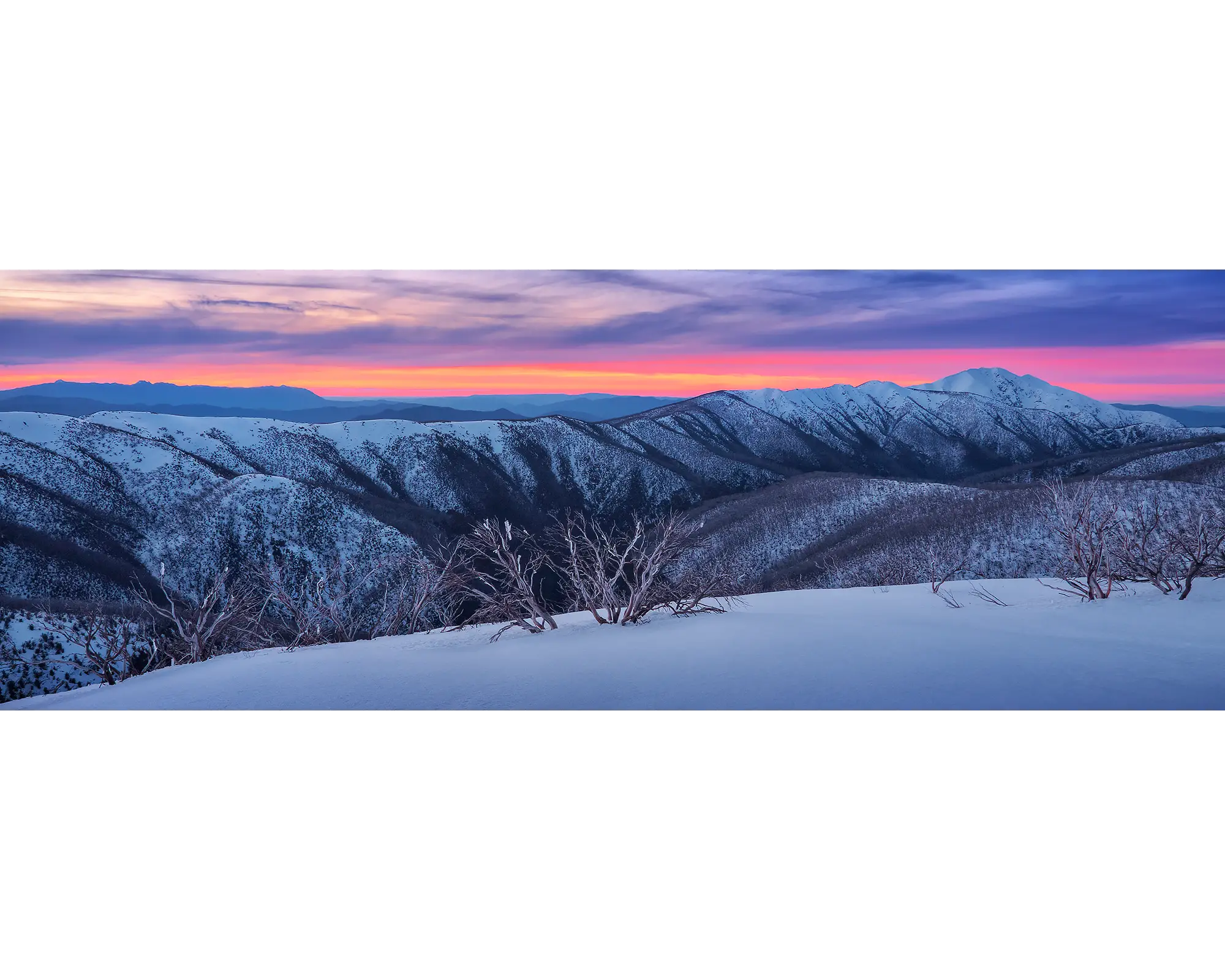 Sunset over the Razorback and Mount Feathertop covered in snow, Alpine National Park, Victoria. 