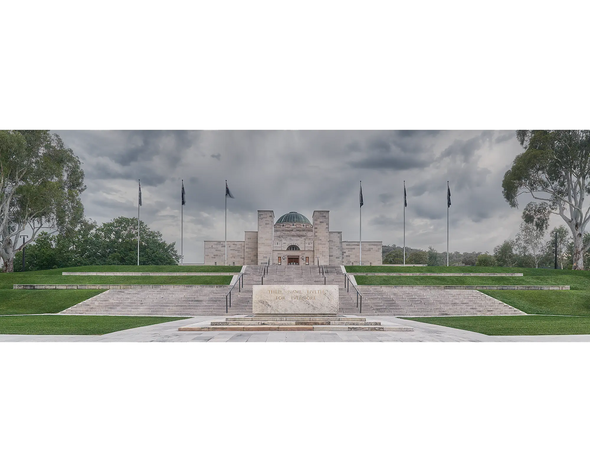 The Australian War Memorial under stormy skies with gum trees in view, Canberra. 