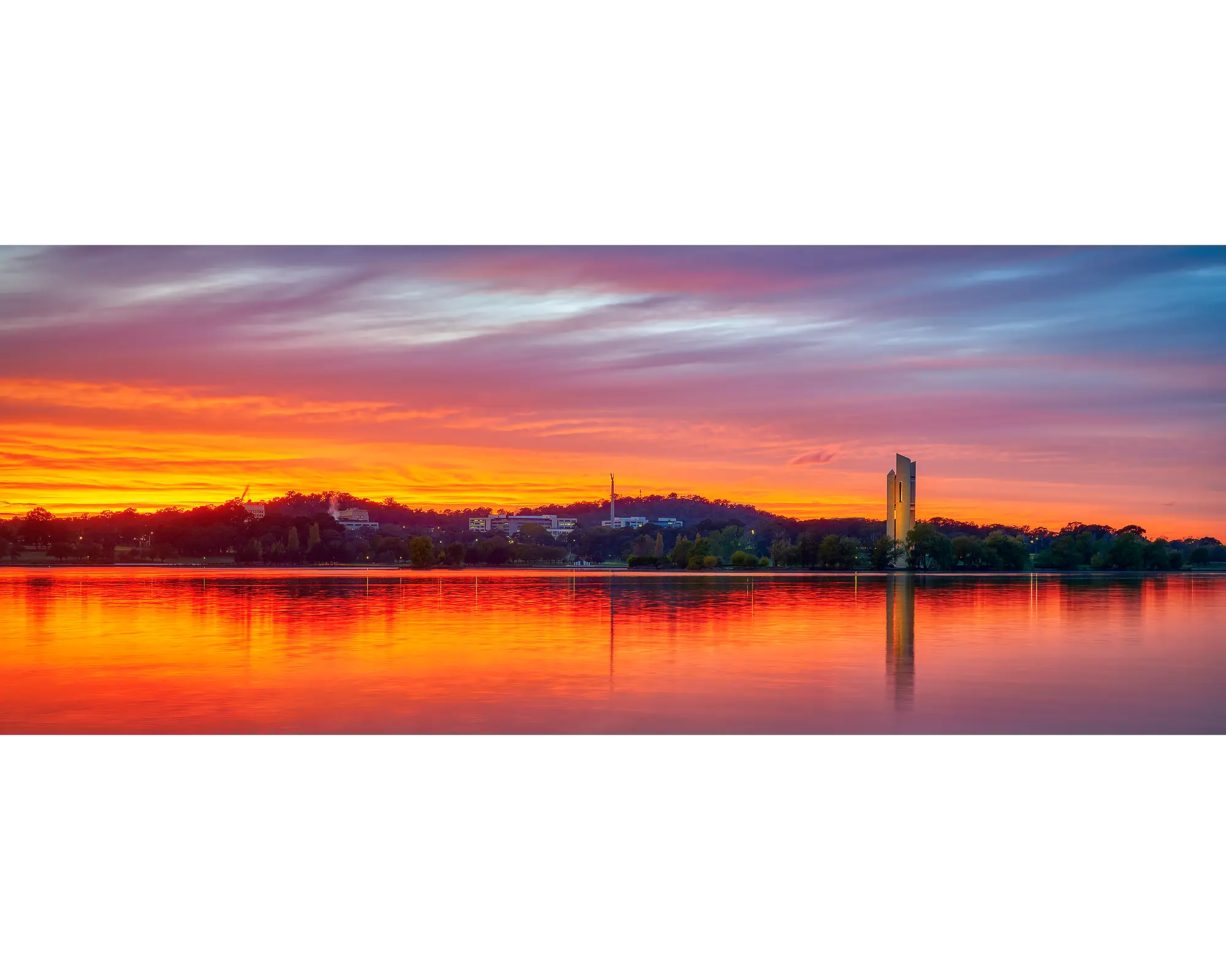 Scarlet sunrise over Rusell Office and Lake Burley Griffin in Canberra.
