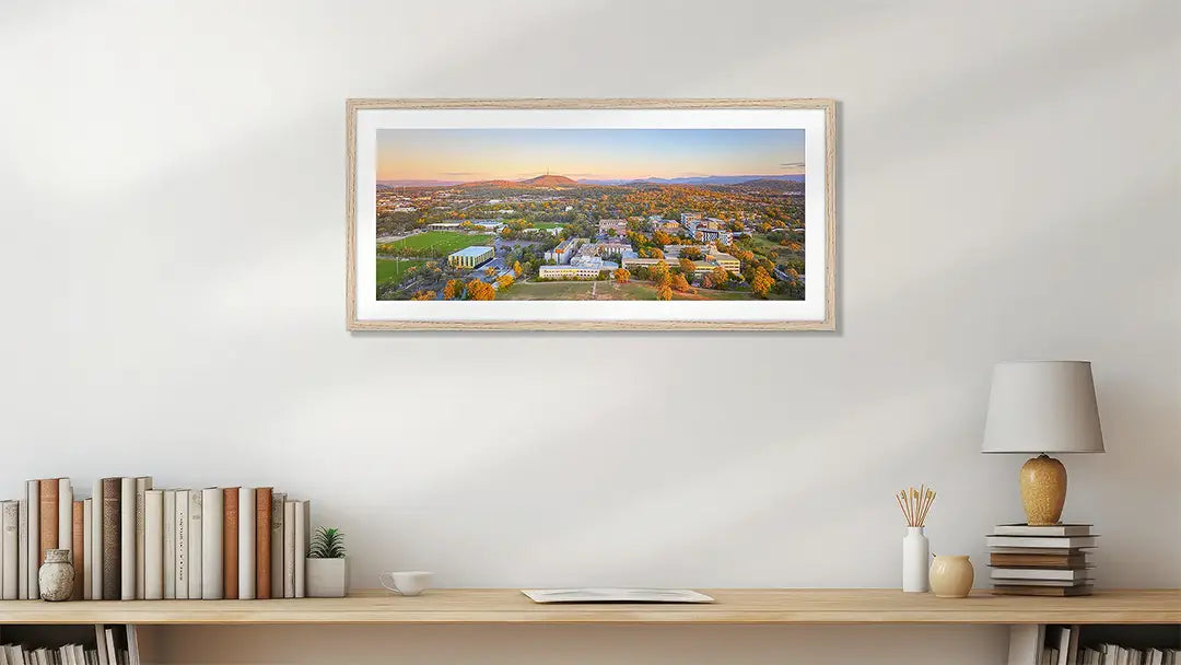University Of Canberra wall art print with wood frame, above a desk.