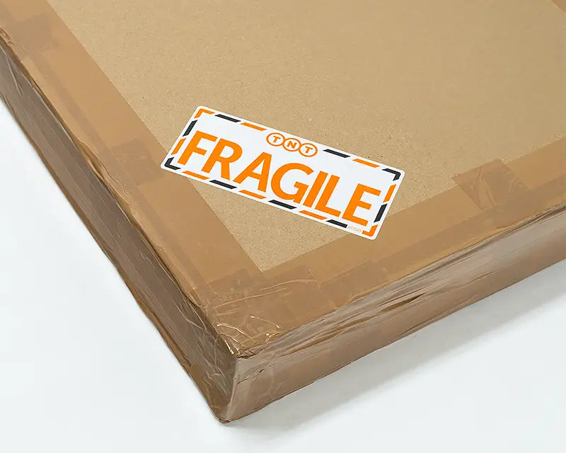 Wall art packaging box with fragile sticker.