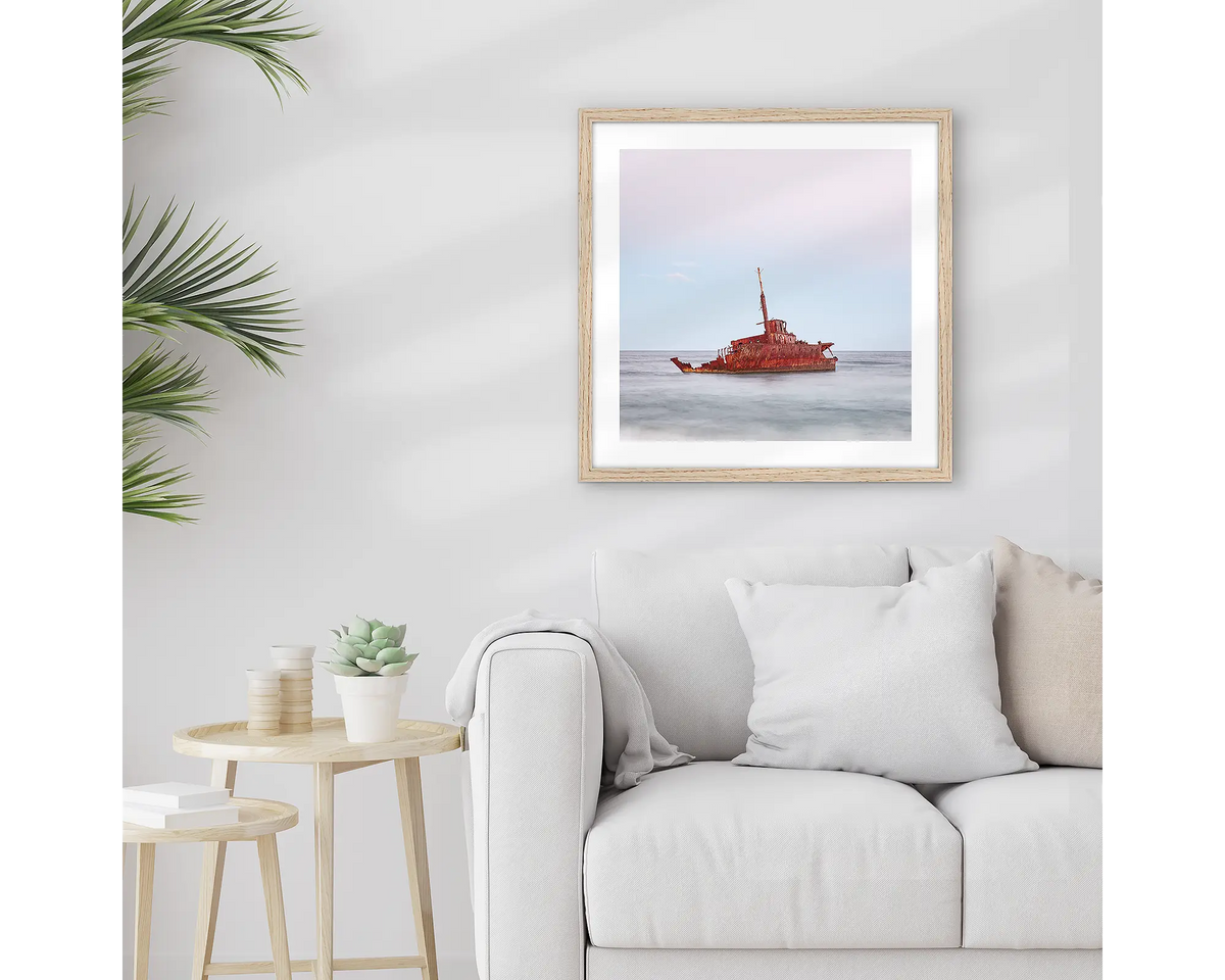 Abandoned. Wall art print of MV Sygna, Stockton Beach, Newcastle, framed in a Tasmanian Oak frame and hung above a lounge room couch. 