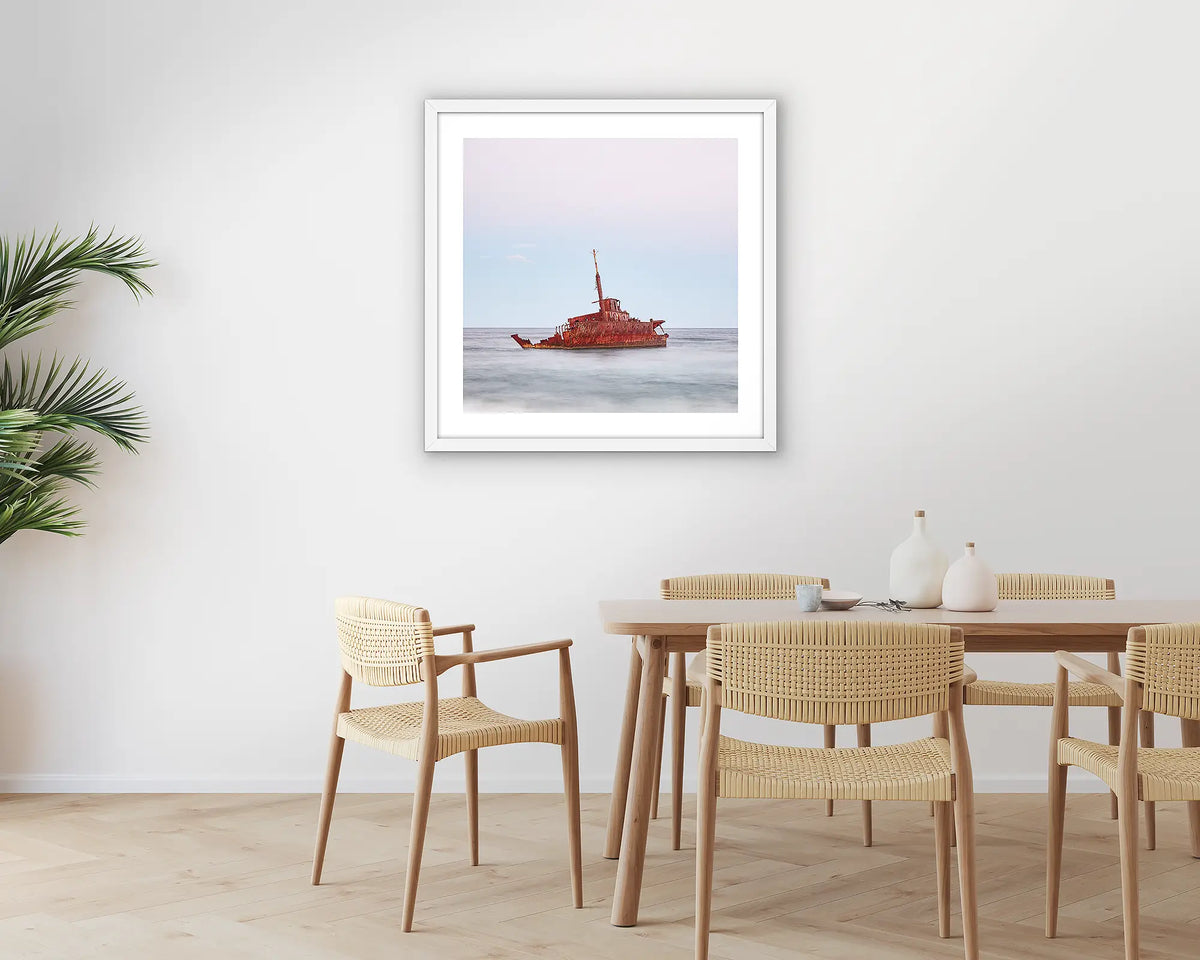 Abandoned. Wall art print of MV Sygna, Stockton Beach, Newcastle, framed in a white frame and hung on a kitchen wall. 