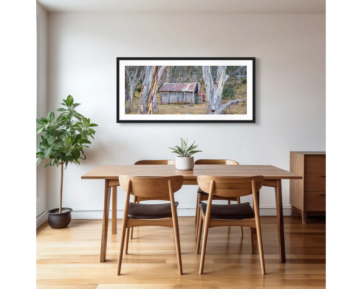 Abode Among the Gum Trees. Cascade Hut, Kosciuszko National Park photographic artwork with a black frame, hung in a kitchen. 