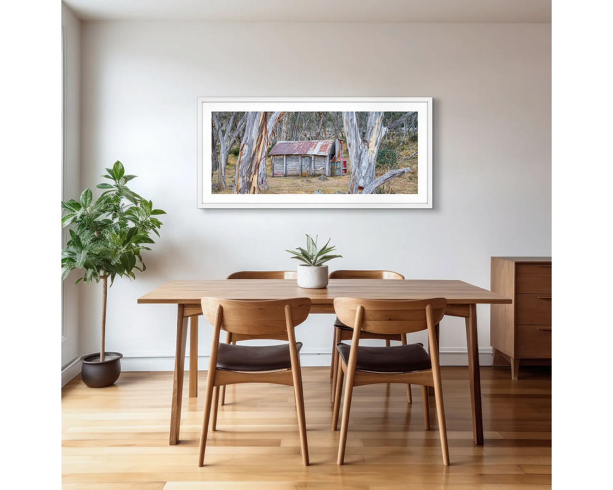 Abode Among the Gum Trees. Cascade Hut, Kosciuszko National Park photographic artwork with a white frame, hung in a kitchen. 