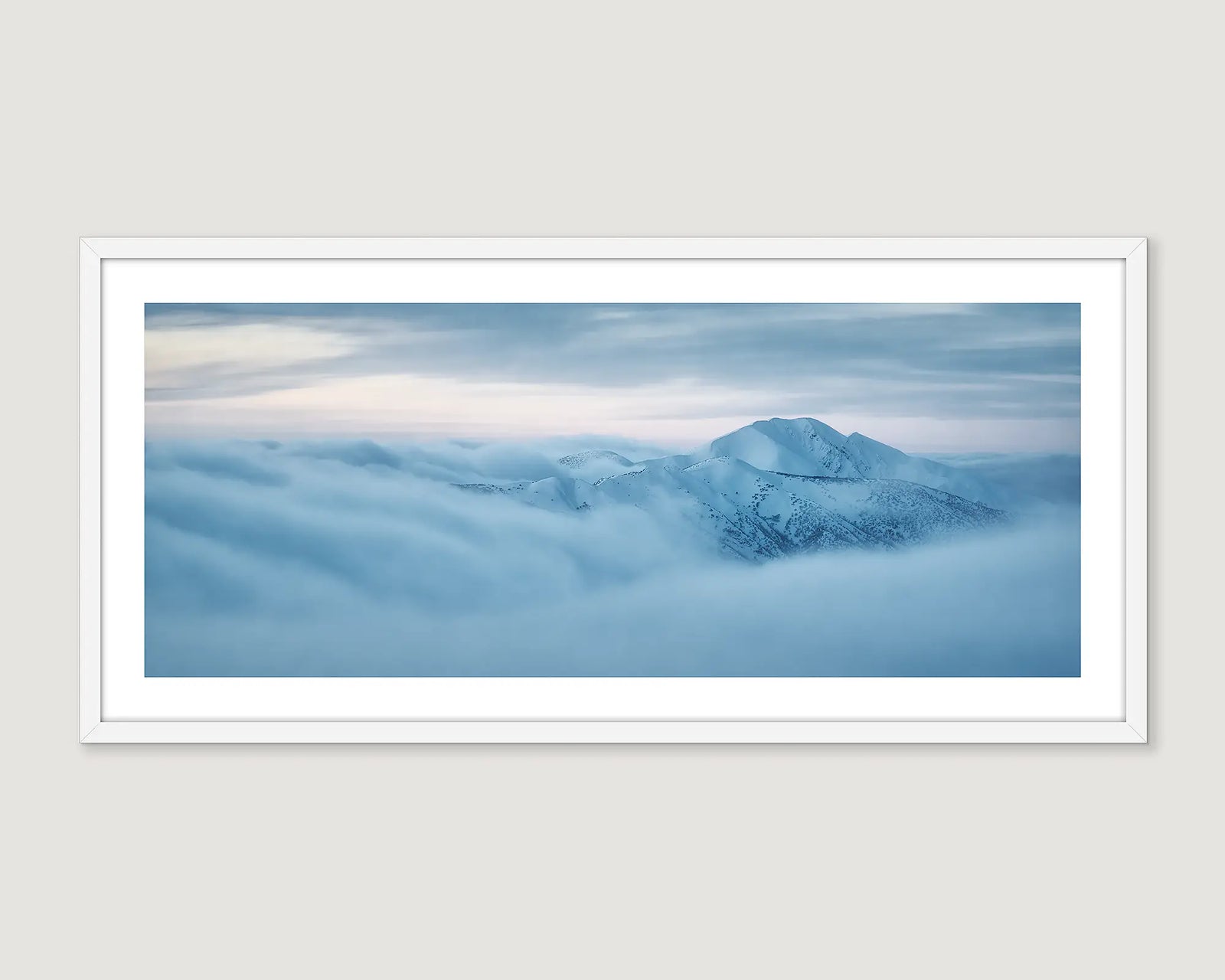 Framed photograph of Mount Feathertop covered in snow and cloud. 