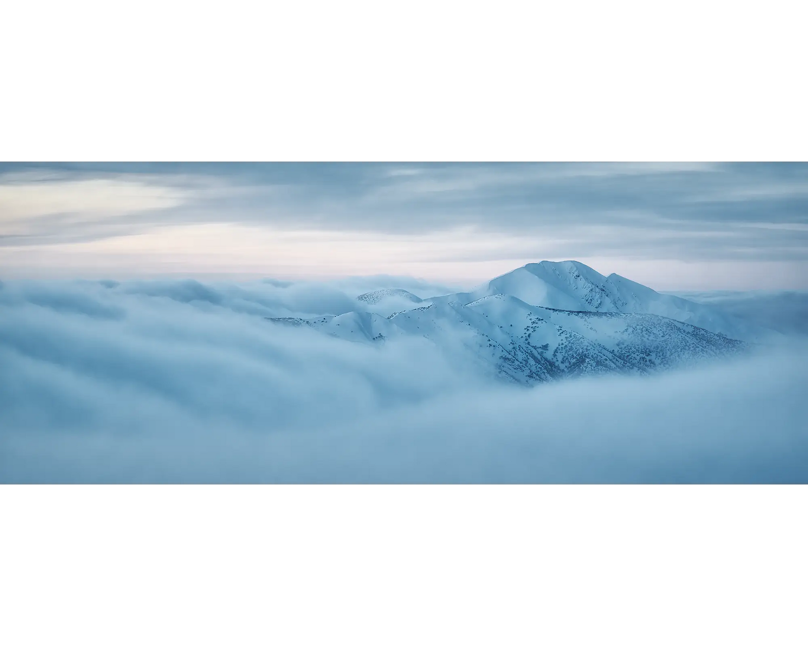 Above it all. Mount Feathertop surrounded by cloud, Alpine National Park, Victoria, Australia.