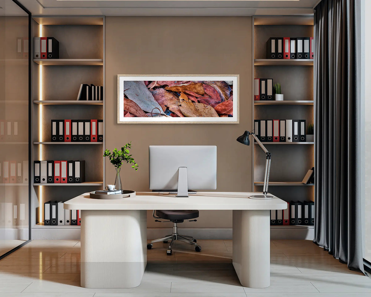 After the Fires. Abstract wall art with a Tasmanian Oak frame hung behind an office desk. 
