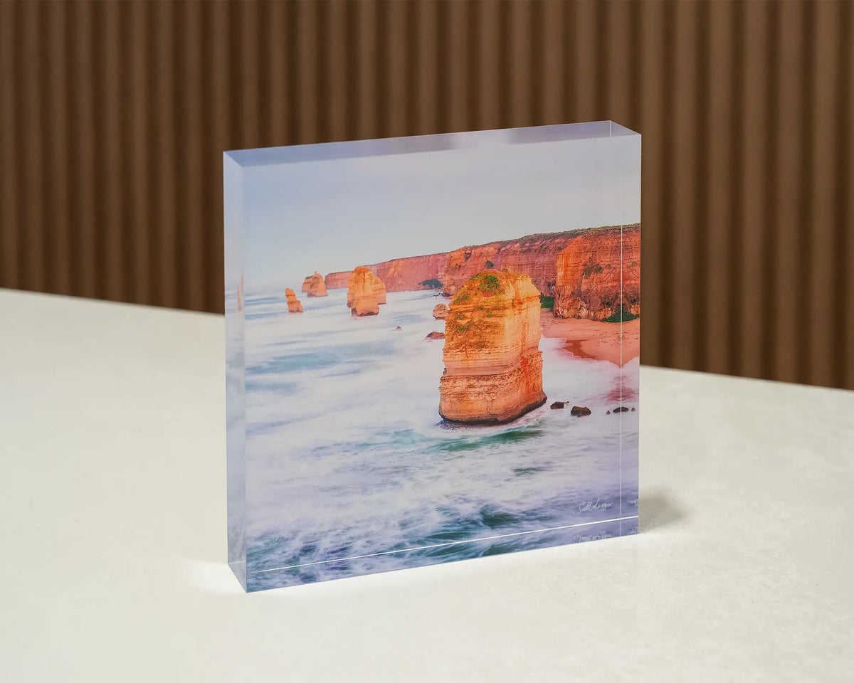 Against The Tide. Acrylic block Twelve Apostles, Great Ocean Road, Victoria, sitting on a desk.