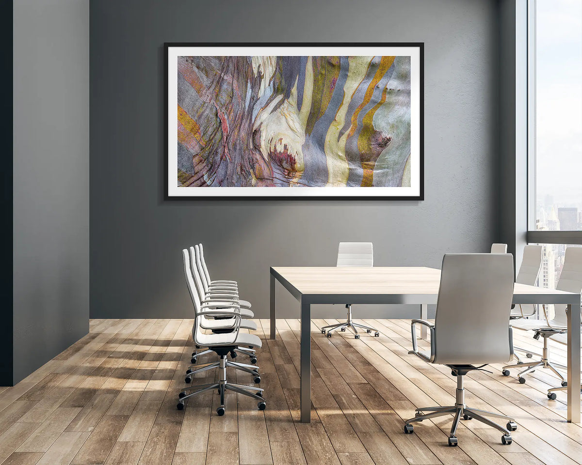 Alive. Abstract snow gum wall art print with a black frame, hung in a corporate boardroom. 