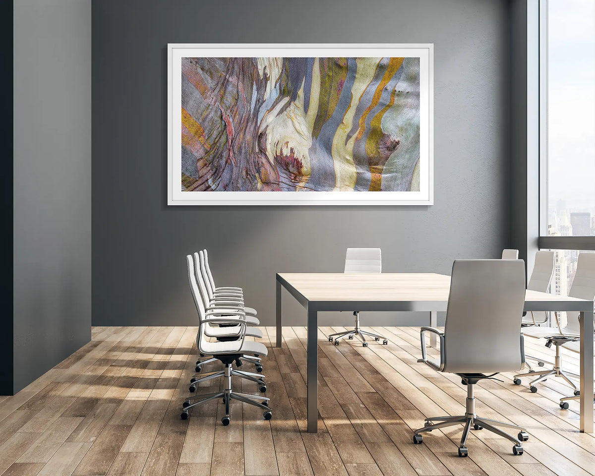 Alive. Abstract snow gum wall art print with a white frame, hung in a corporate boardroom. 