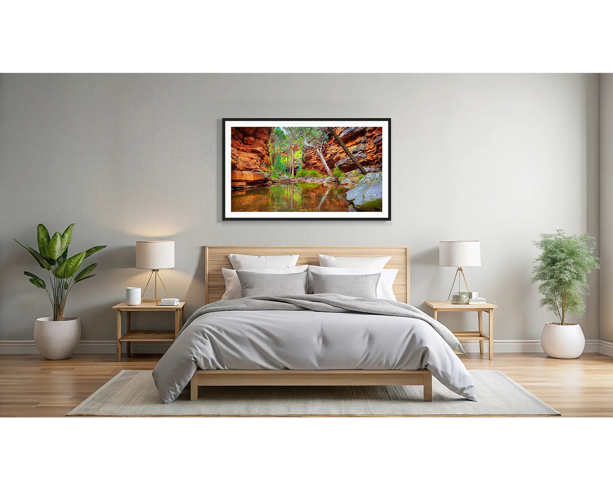 Alligator Gorge. Wall art print of Flinders Ranges with a black frame, hanging above a bed.