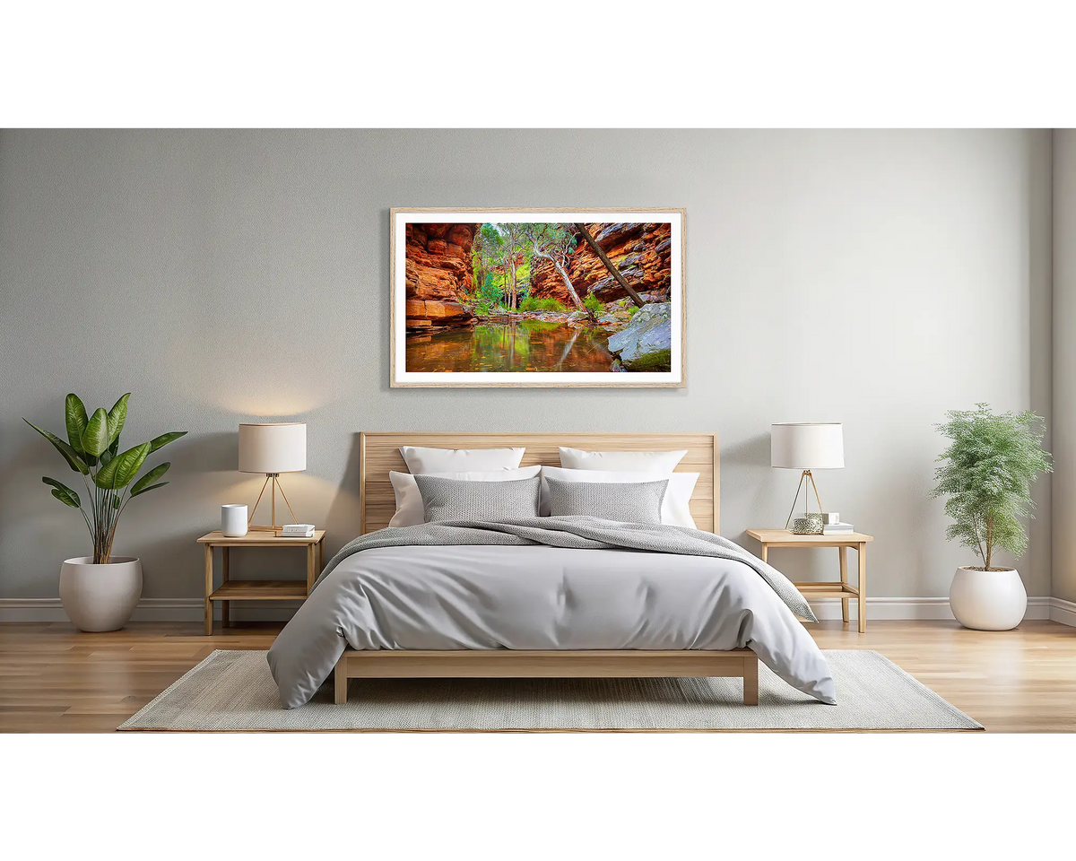 Alligator Gorge. Wall art print of Flinders Ranges with a Tasmanian Oak frame, hanging above a bed.