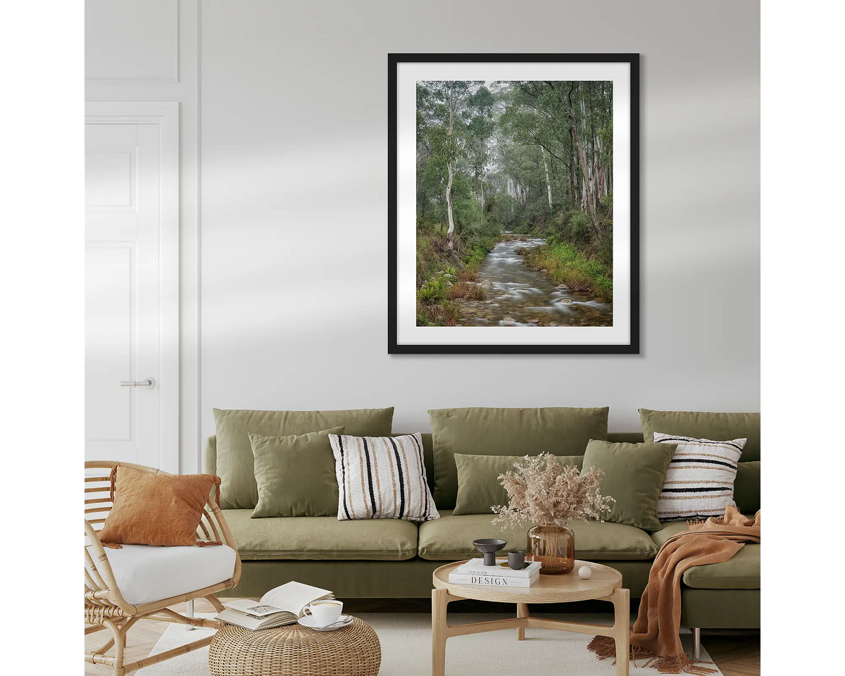 Allure. Eurobin Creek, Mount Buffalo photographic wall art print with a black frame, hung in a lounge room above a couch.