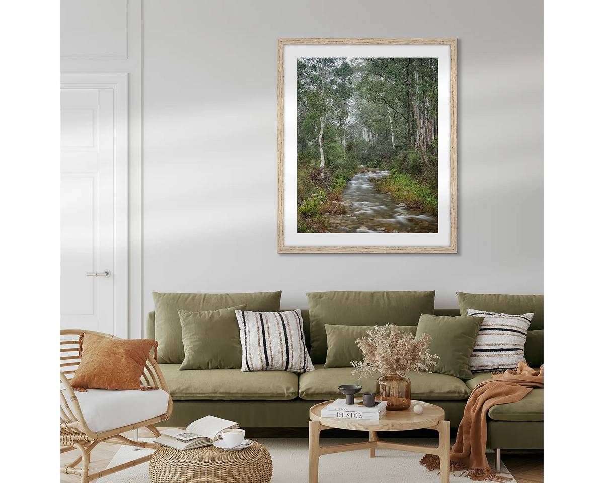 Allure. Eurobin Creek, Mount Buffalo photographic wall art print with a Tasmanian Oak frame, hung in a lounge room above a couch.
