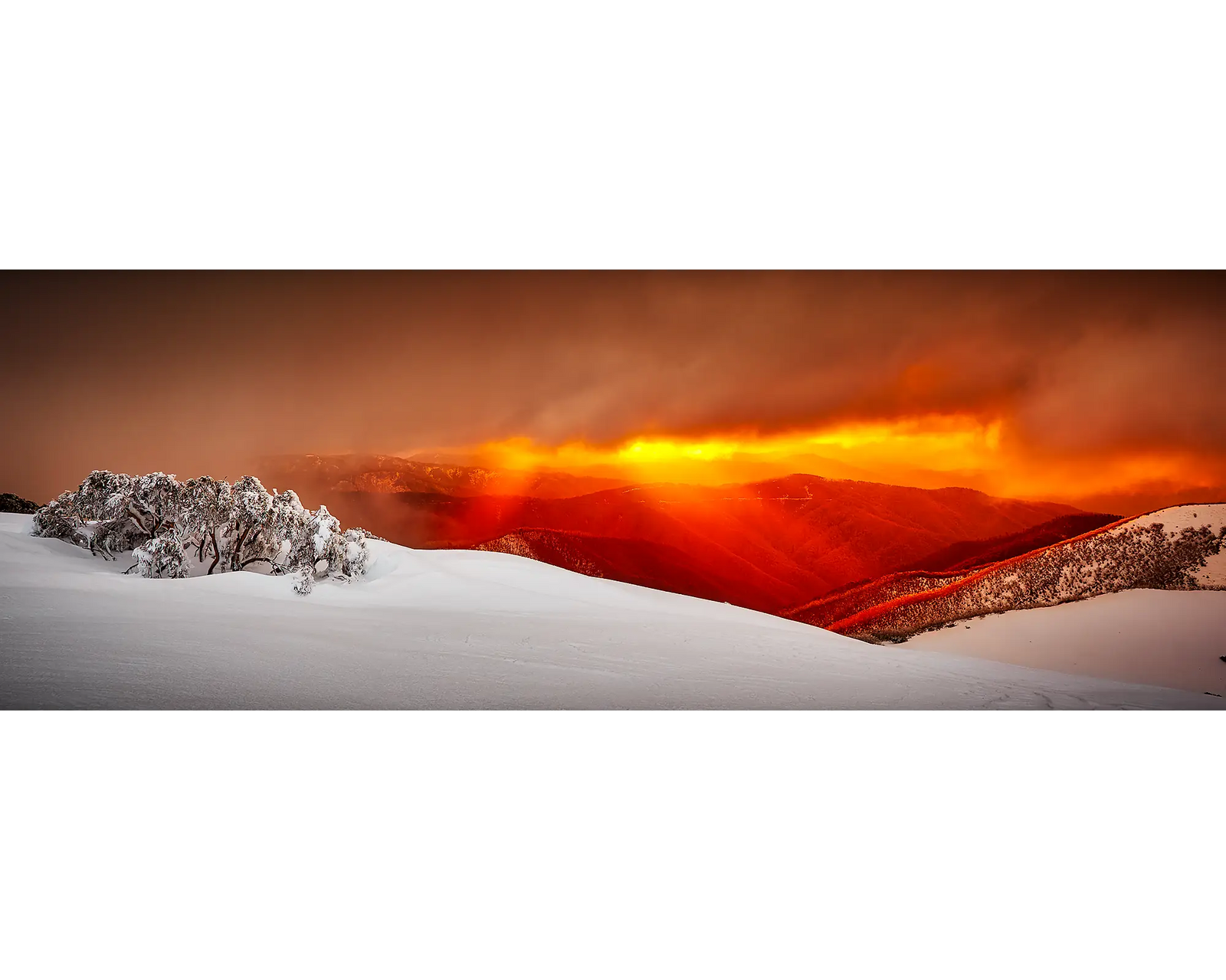 Clouds and rays of light over snow covered Mount Hotham, Victoria. 
