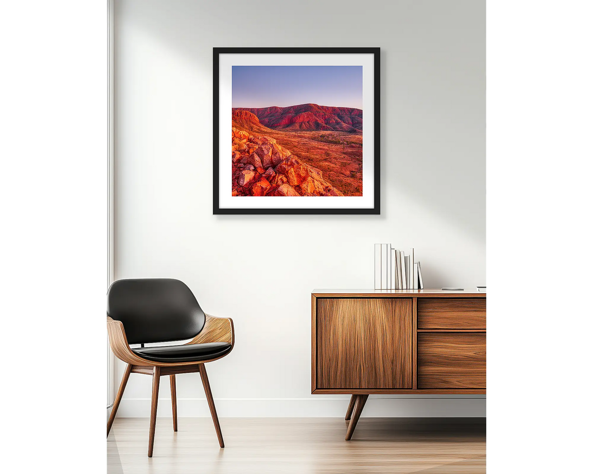 Ancient Dawn. Wall art print of Ormiston Pound at sunrise, in a black frame and hung beside an apartment window.