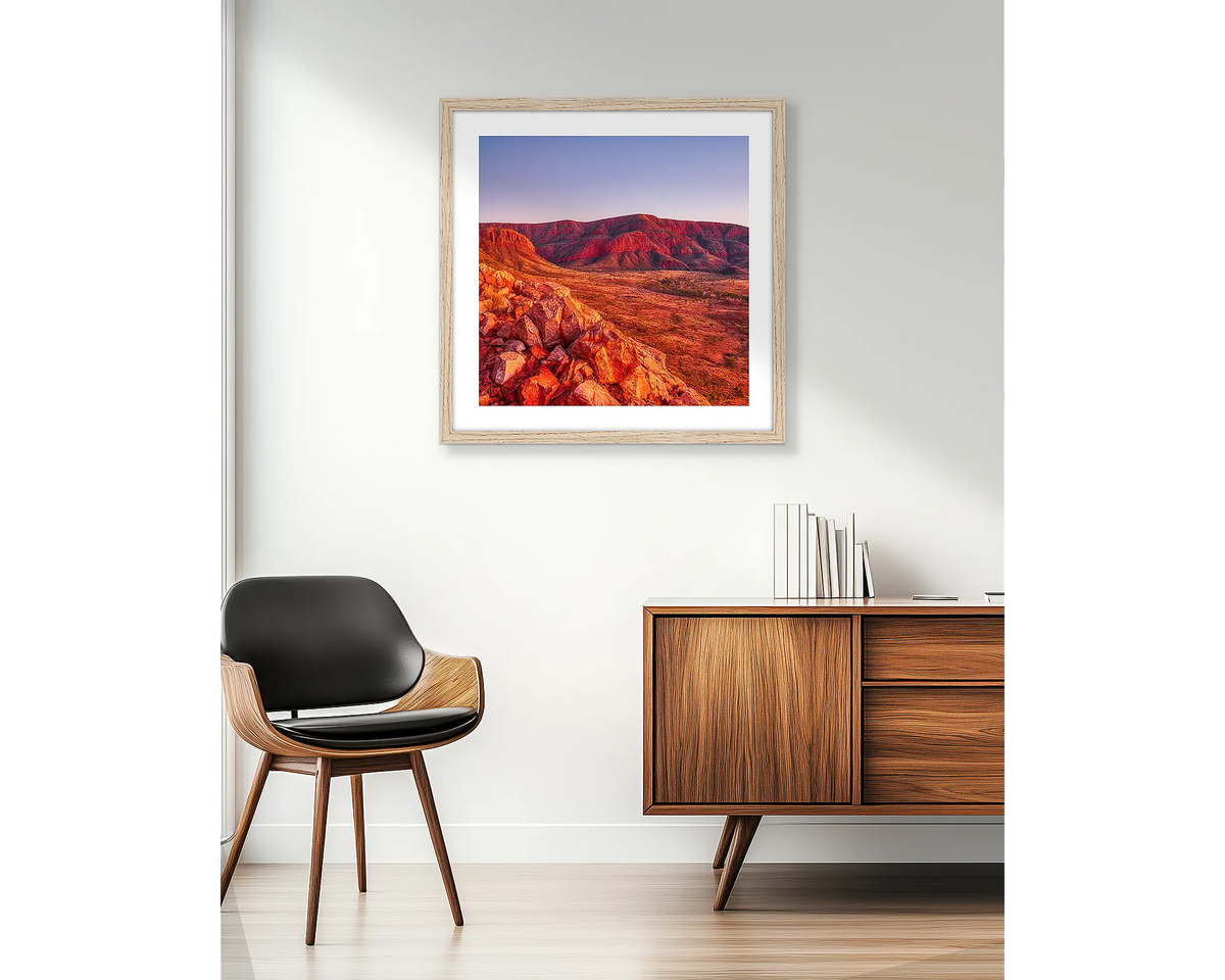 Ancient Dawn. Wall art print of Ormiston Pound at sunrise, in a Tasmanian Oak frame and hung beside an apartment window.