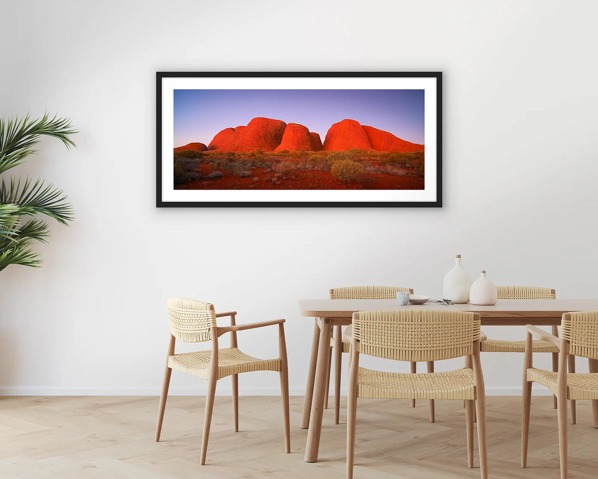 Ancient Land. Photographic wall art print with a black frame, of Kata Juta, the Olgas at sunset, hung in a dining room. 