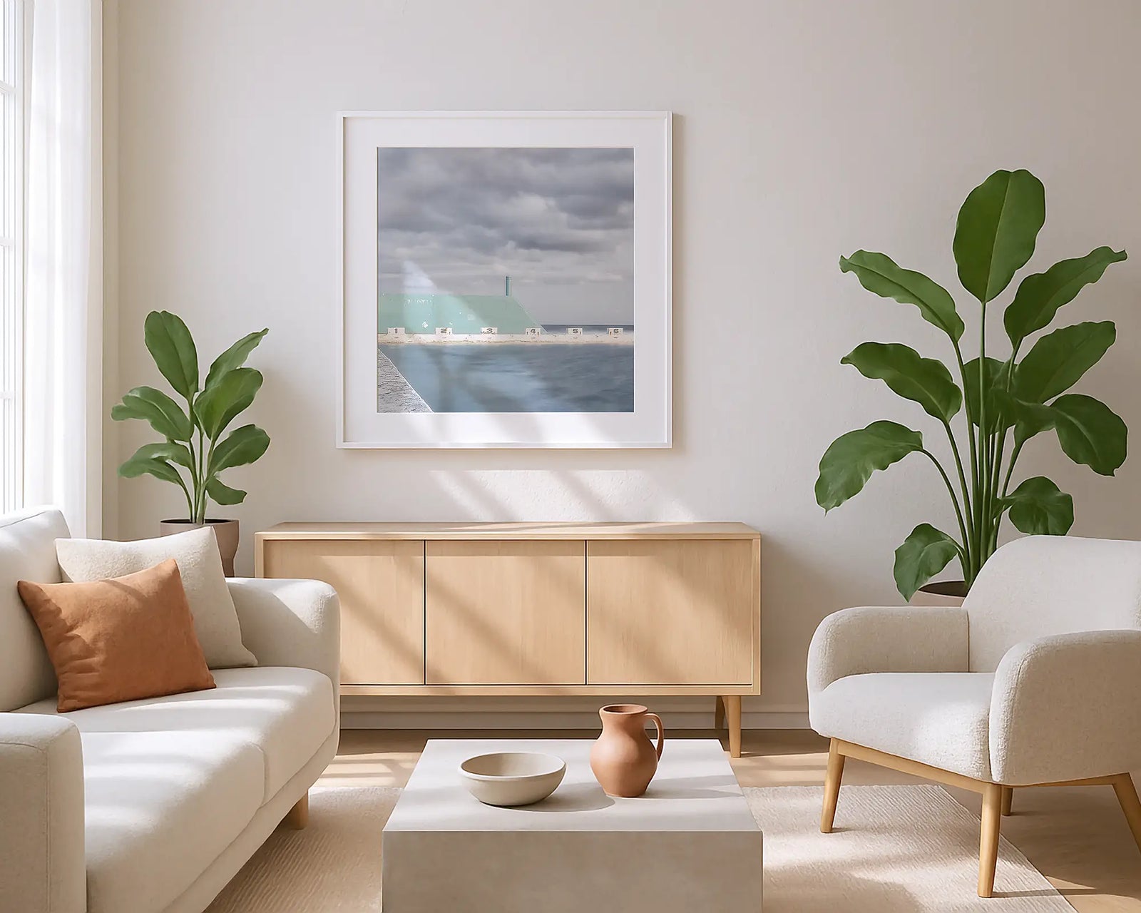 Framed photographic print of a coastal image of Newcastle Baths on a stormy day. 