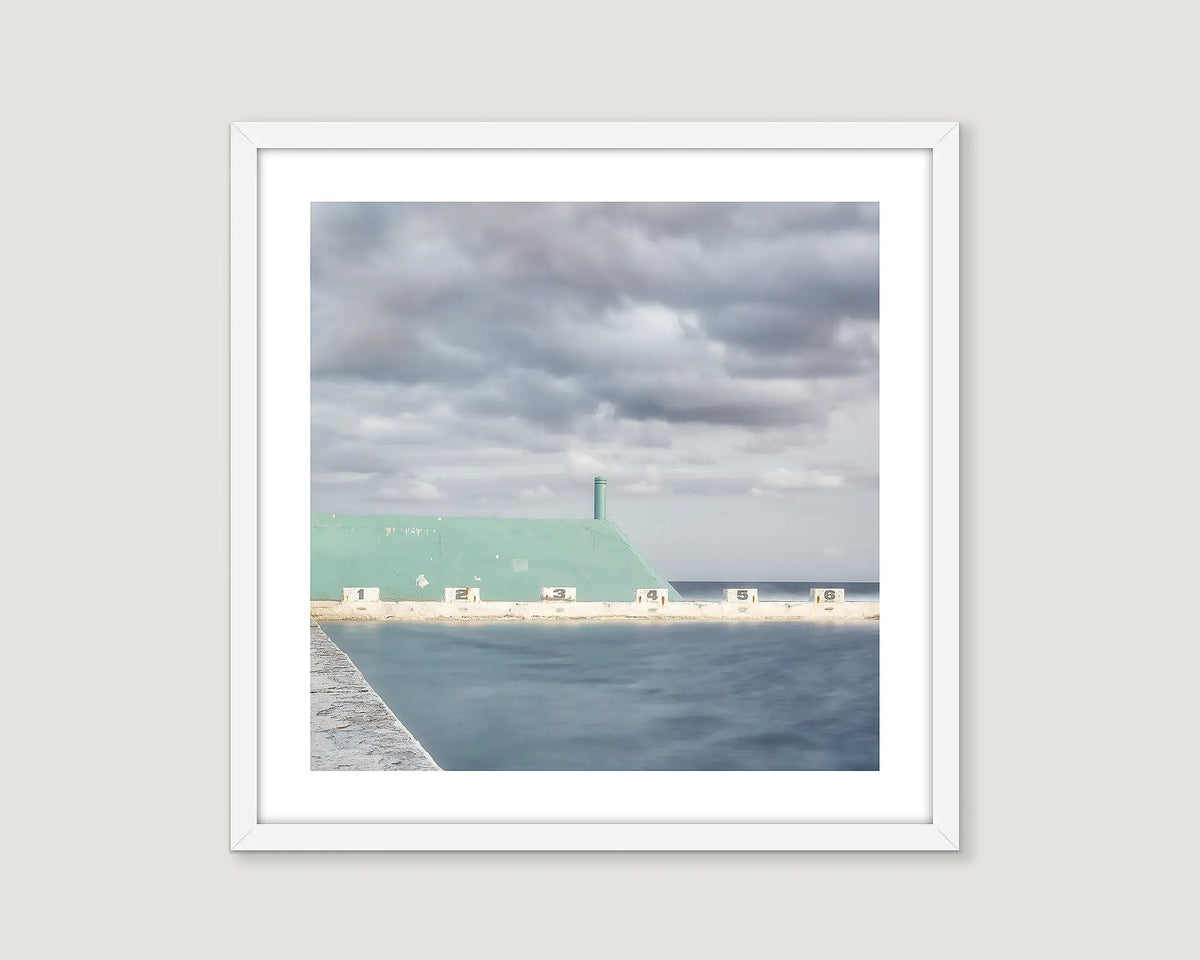 Framed photographic print of a coastal image of Newcastle Baths on a stormy day. 