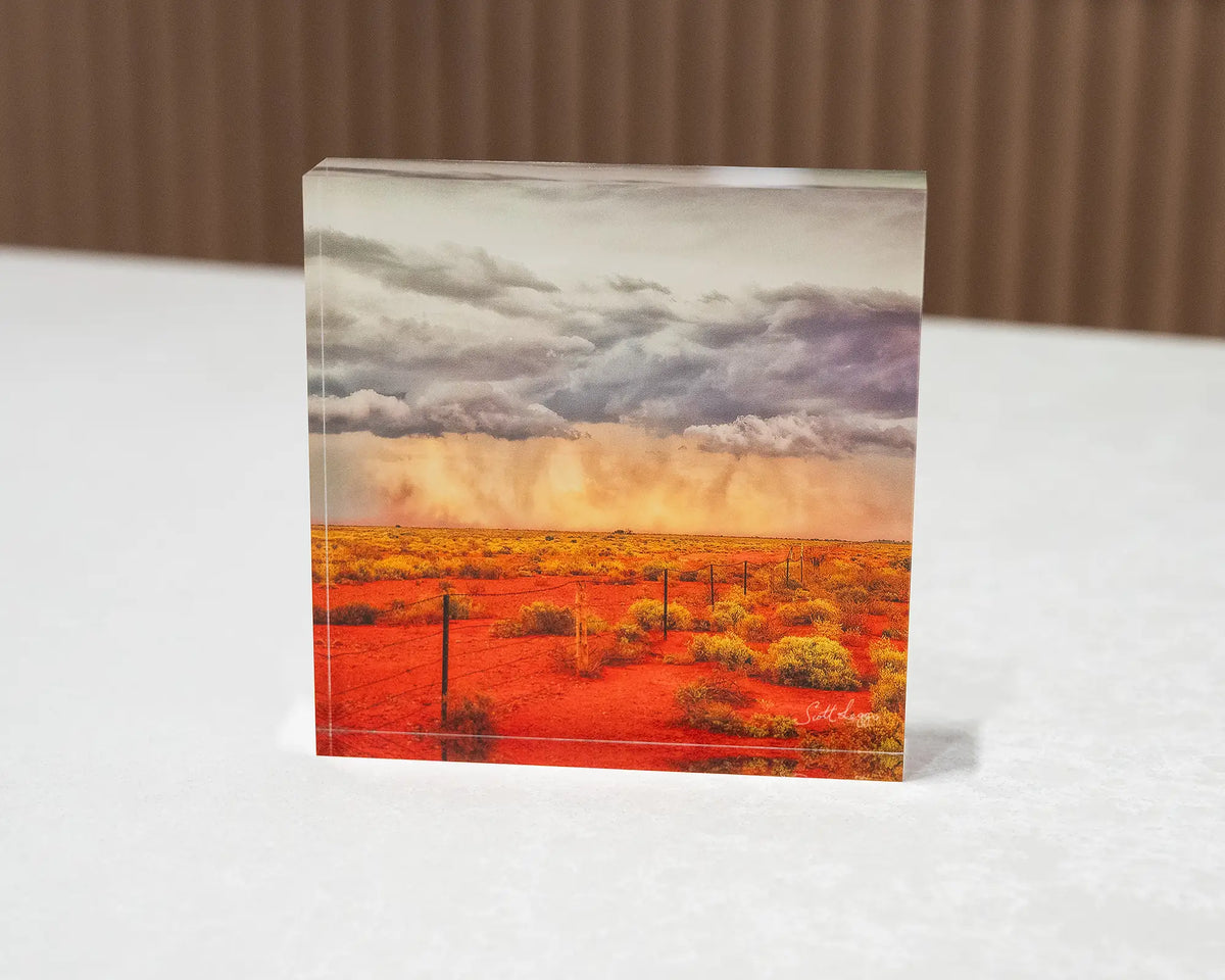 Approaching Storm. Acrylic block of an outback storm, South Australia, sitting on a desk.