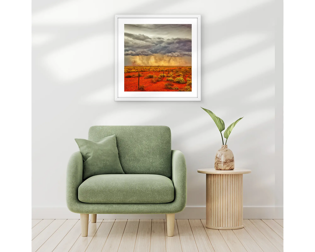 Approaching Storm. Outback artwork in a white frame, and hung in an entrance hallway above a chair. 