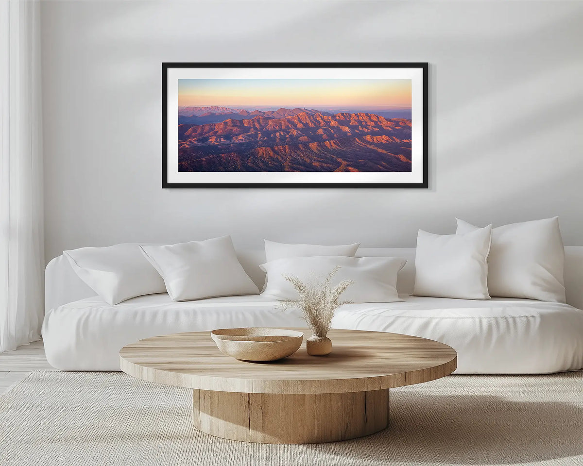 Art of the Ages. Black framed wall art print of Flinders Ranges, hung in a scandi-themed lounge room. 