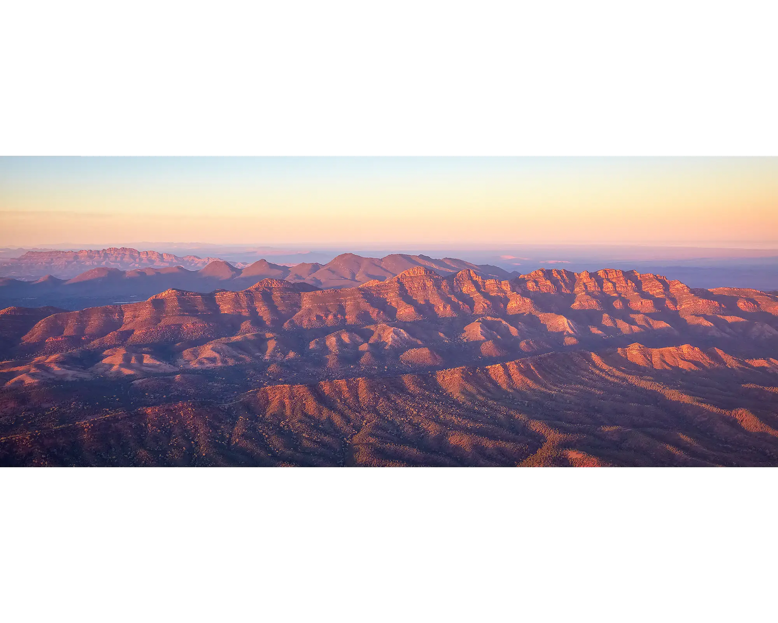 Framed wall art print of a sunrise over Flinders Ranges with Wilpena Pound in view. 