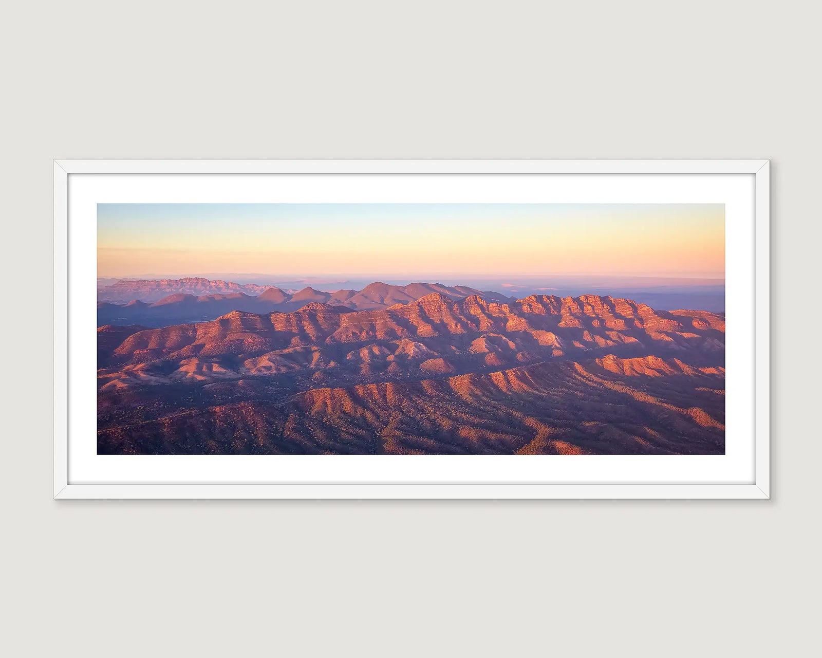 Framed wall art print of a sunrise over Flinders Ranges with Wilpena Pound in view. 
