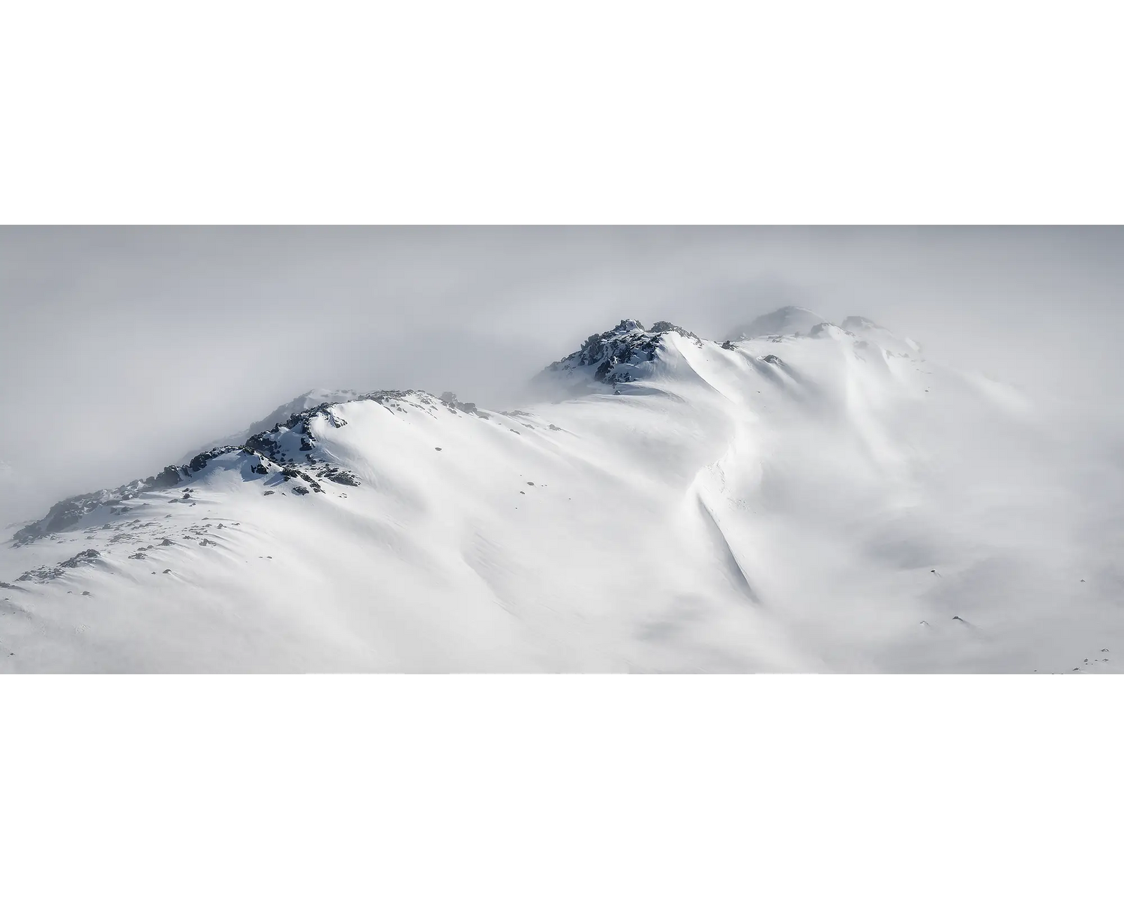 Ascent. Winter snow along a mountain ridge in Kosciuszko National Park.