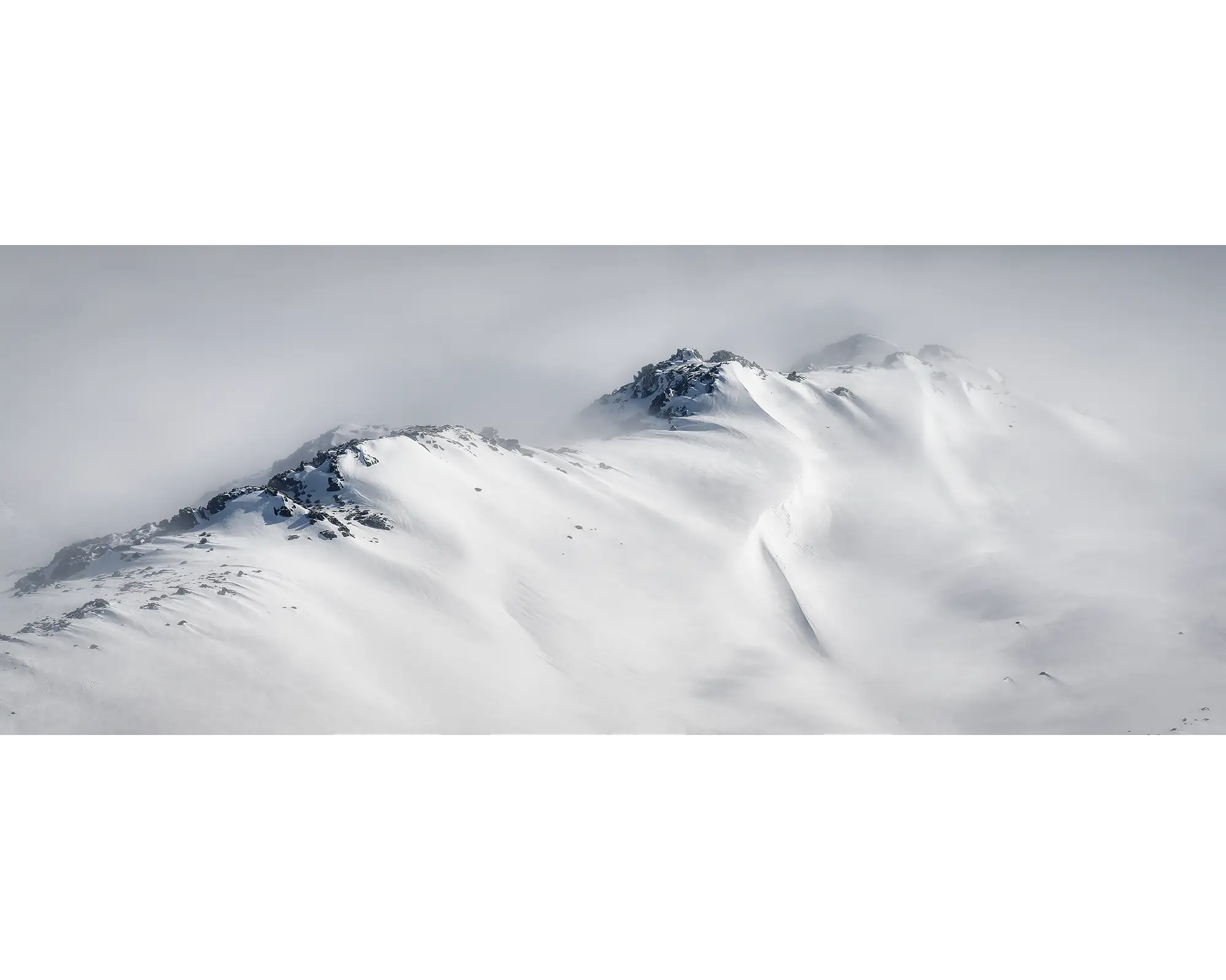 Ascent - Winter snow along a mountain ridge in Kosciuszko National Park.