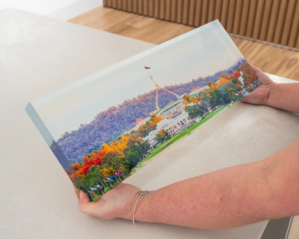 Autumn Bubble. Hand held acrylic block of Autumn trees surrounding Old and New Parliament House, Canberra.