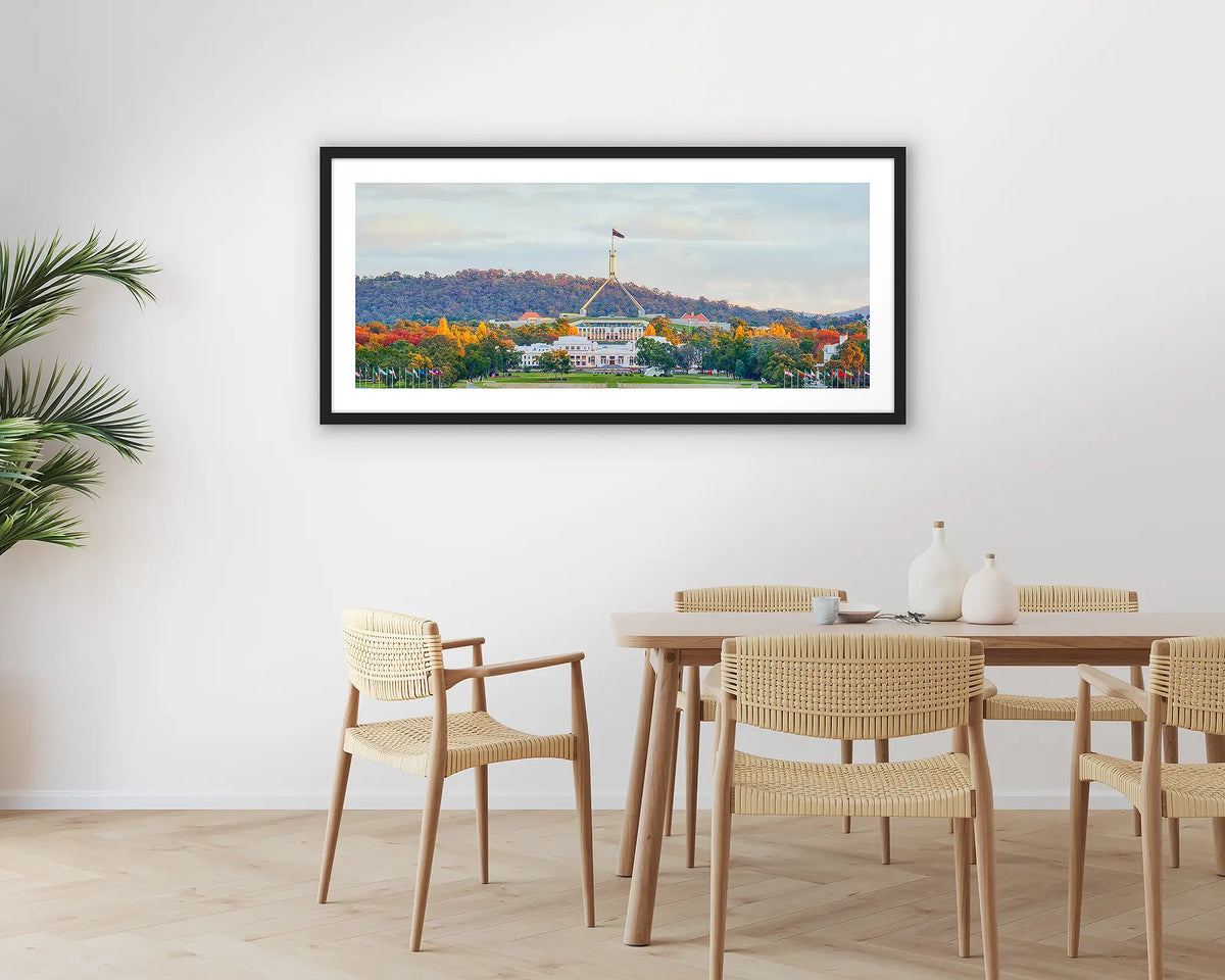 Autumn Bubble. Photographic wall art print with a black frame, of old and new parliament house, Canberra, hung in a dining room. 