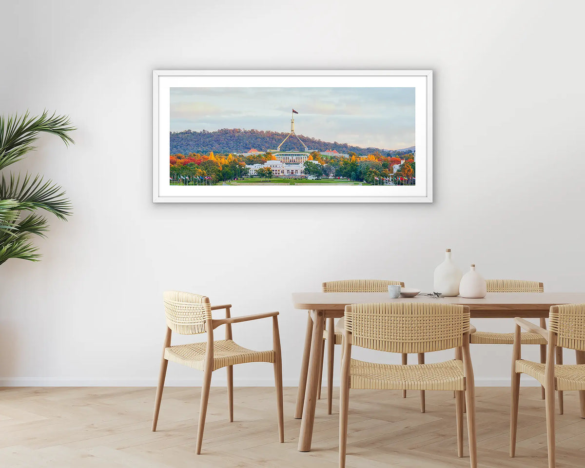 Autumn Bubble. Photographic wall art print with a white frame, of old and new parliament house, Canberra, hung in a dining room. 