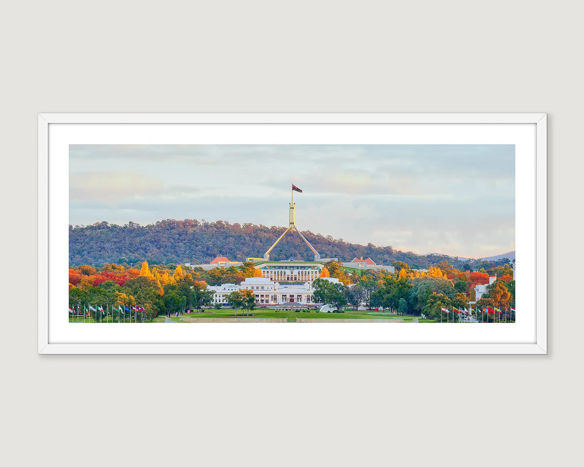 Framed wall art print of both old and new Parliament House on an autumn evening. 