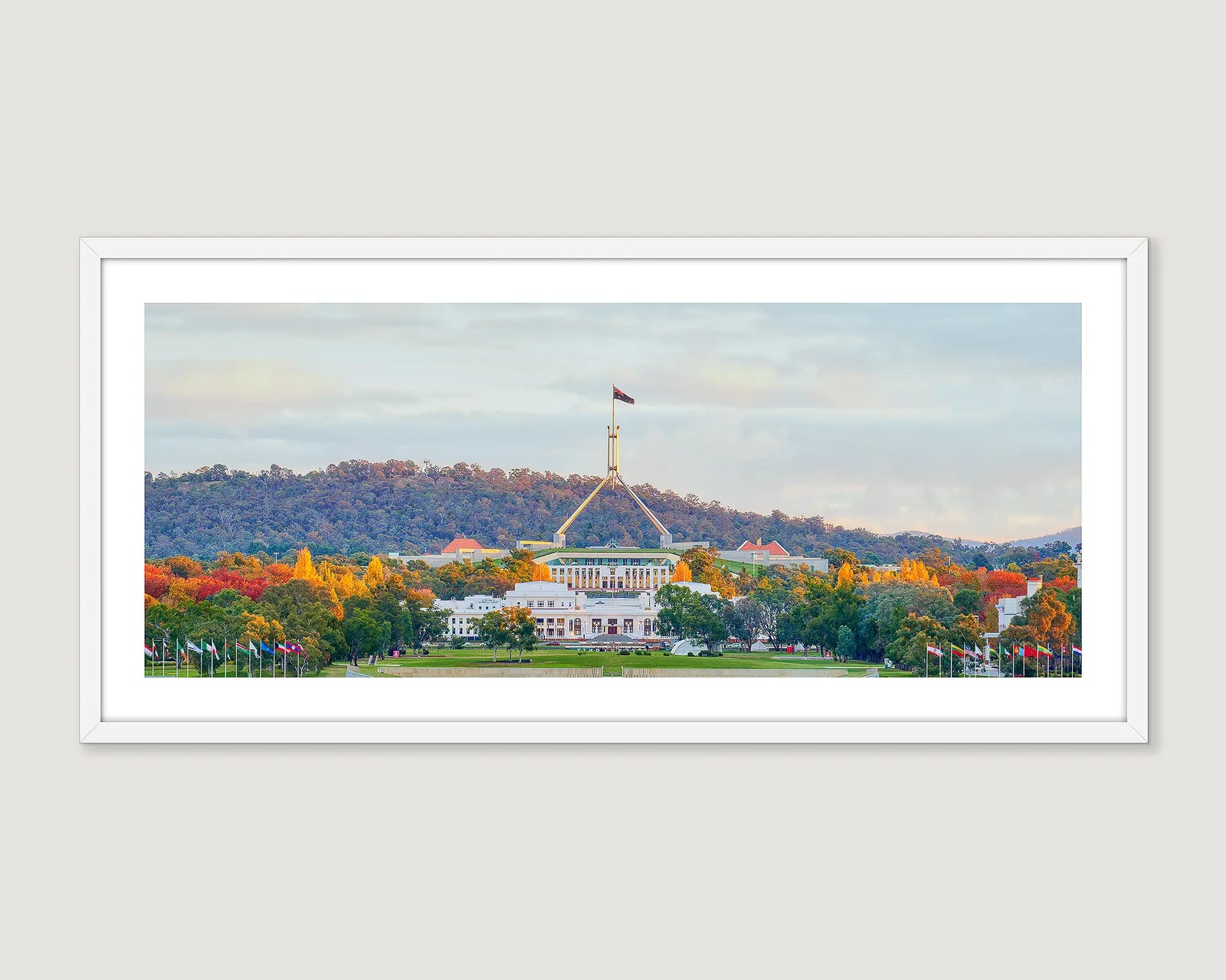 Framed wall art print of both old and new Parliament House on an autumn evening. 