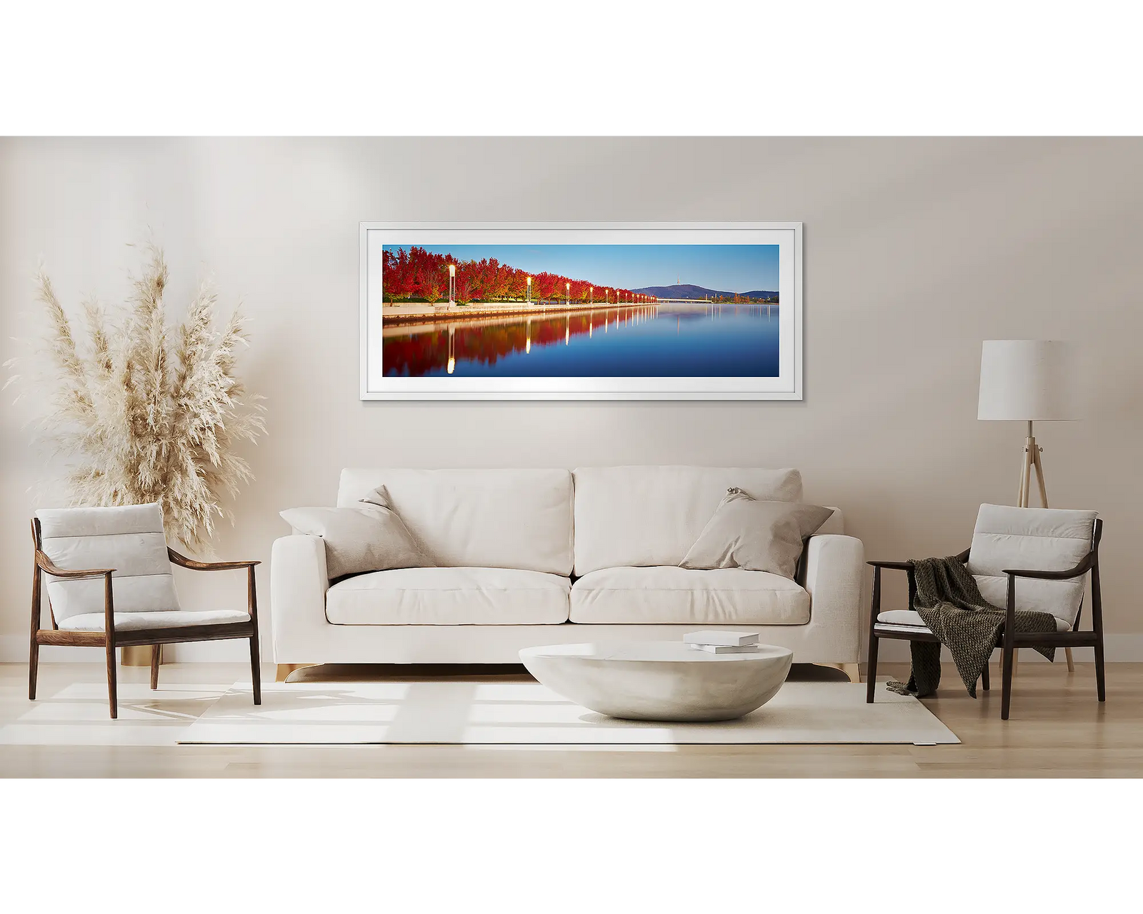 Red autumn trees beside Lake Burley Griffin at sunrise. 