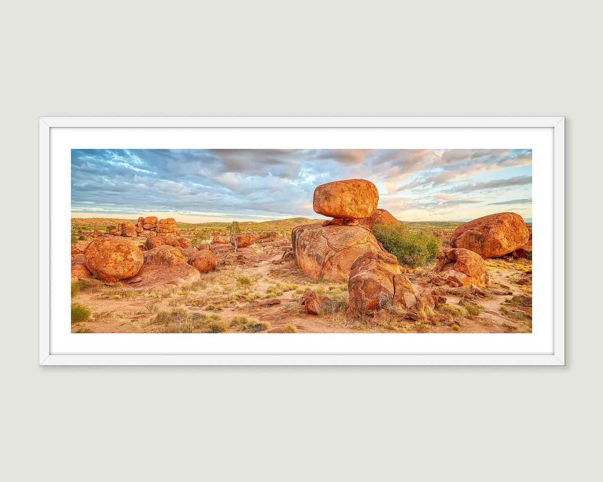 Framed photograph of a desert landscape with unique Devils Marbles rock formations.