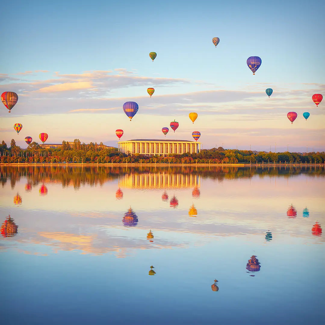 Balloon Spectacular - balloons over Canberra during balloon festival with reflections on lake burley griffin