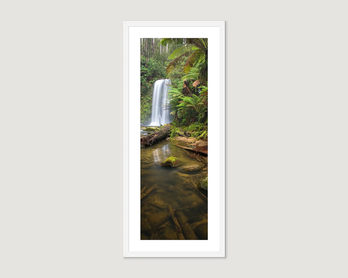 Framed photograph of a Beauchamp Waterfall in a lush green forest on a light gray background.