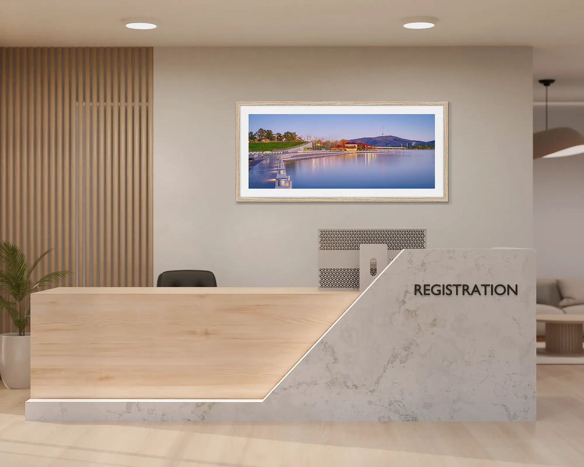 Before the Rush. Canberra wall art print with a timber frame, hung behind a reception desk. 
