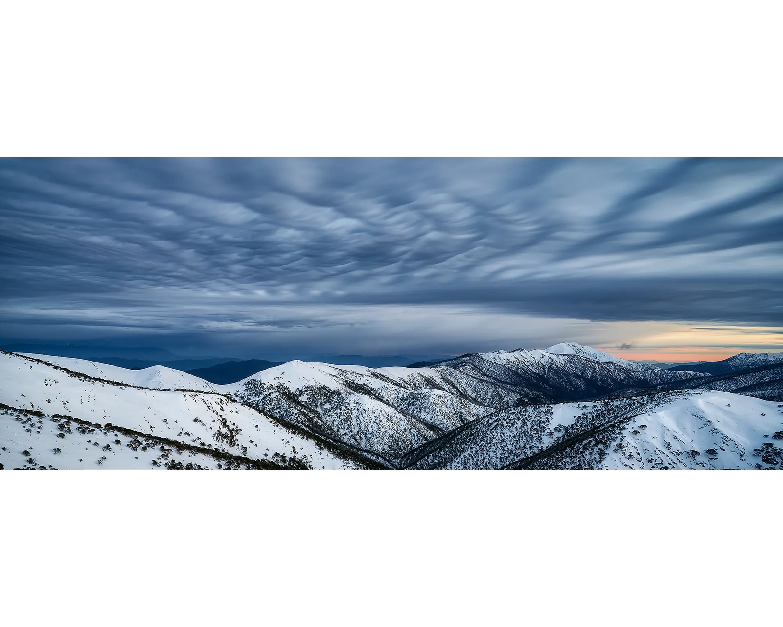 Before The Storm. Clouds over snow covered Razorback and Mount Feathertop summit.