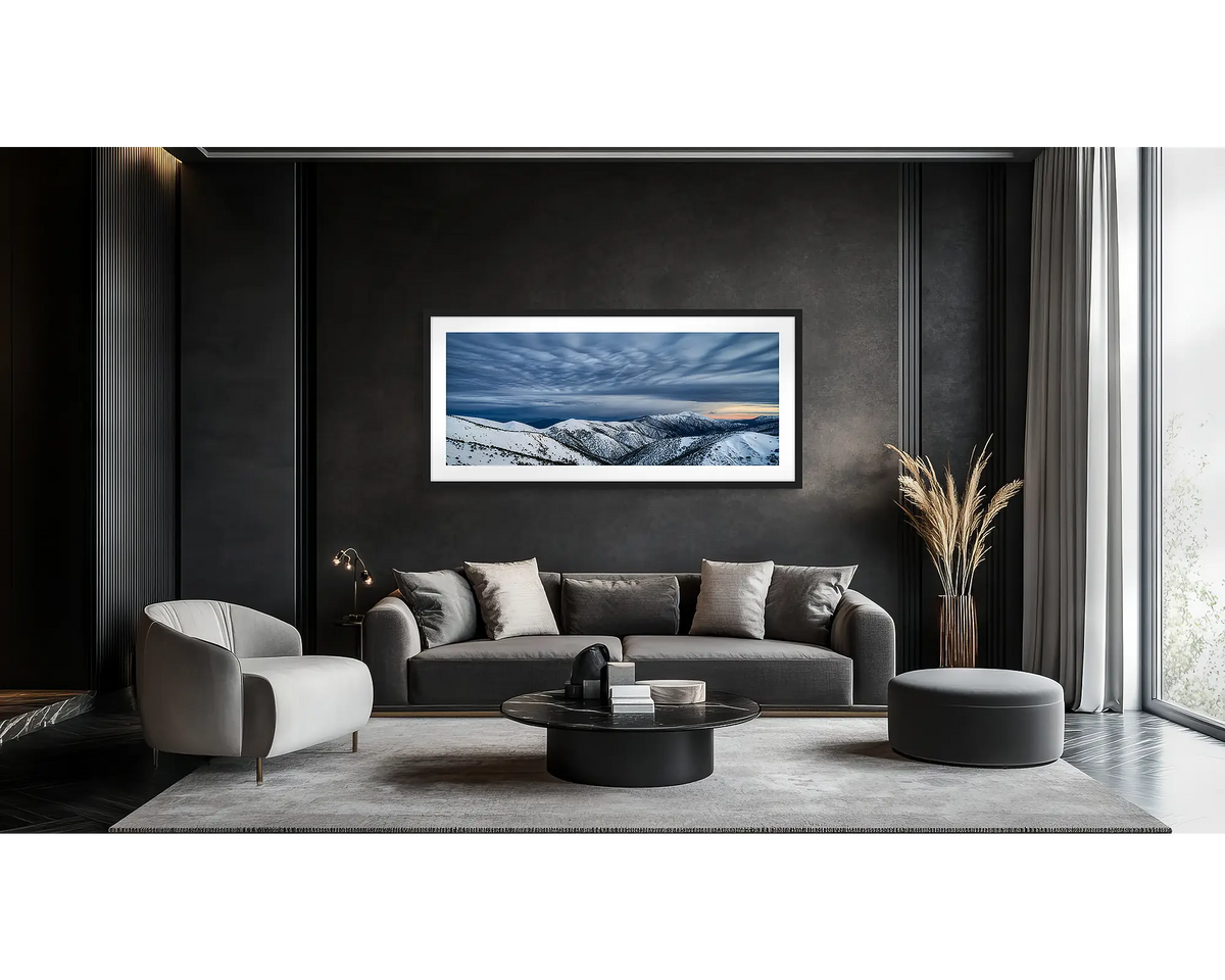 Before the Storm. Wall art print of cloud formations over Mount Feathertop, framed in a black frame, and hung in a lounge room. 