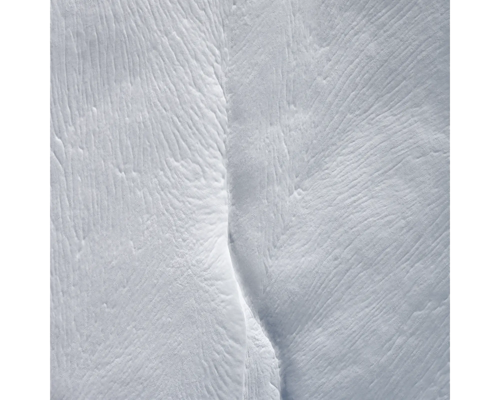 Beginning. Aerial view of Swampy Plains River covered in snow, Kosciuszko National Park, New South Wales, Australia. 
