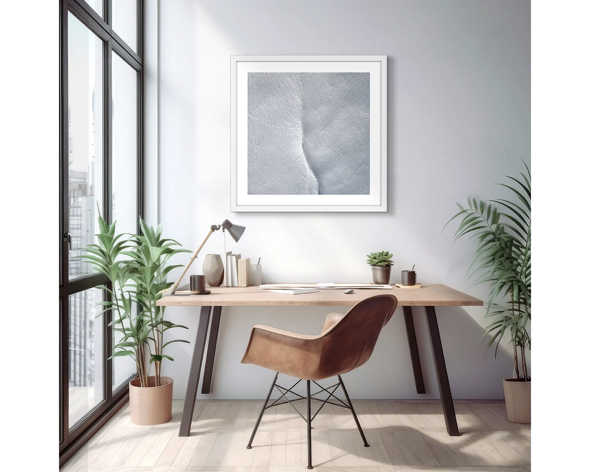 Beginning. Wall art print of Swampy Plain River viewed from above, with a white frame in a light filled apartment. 