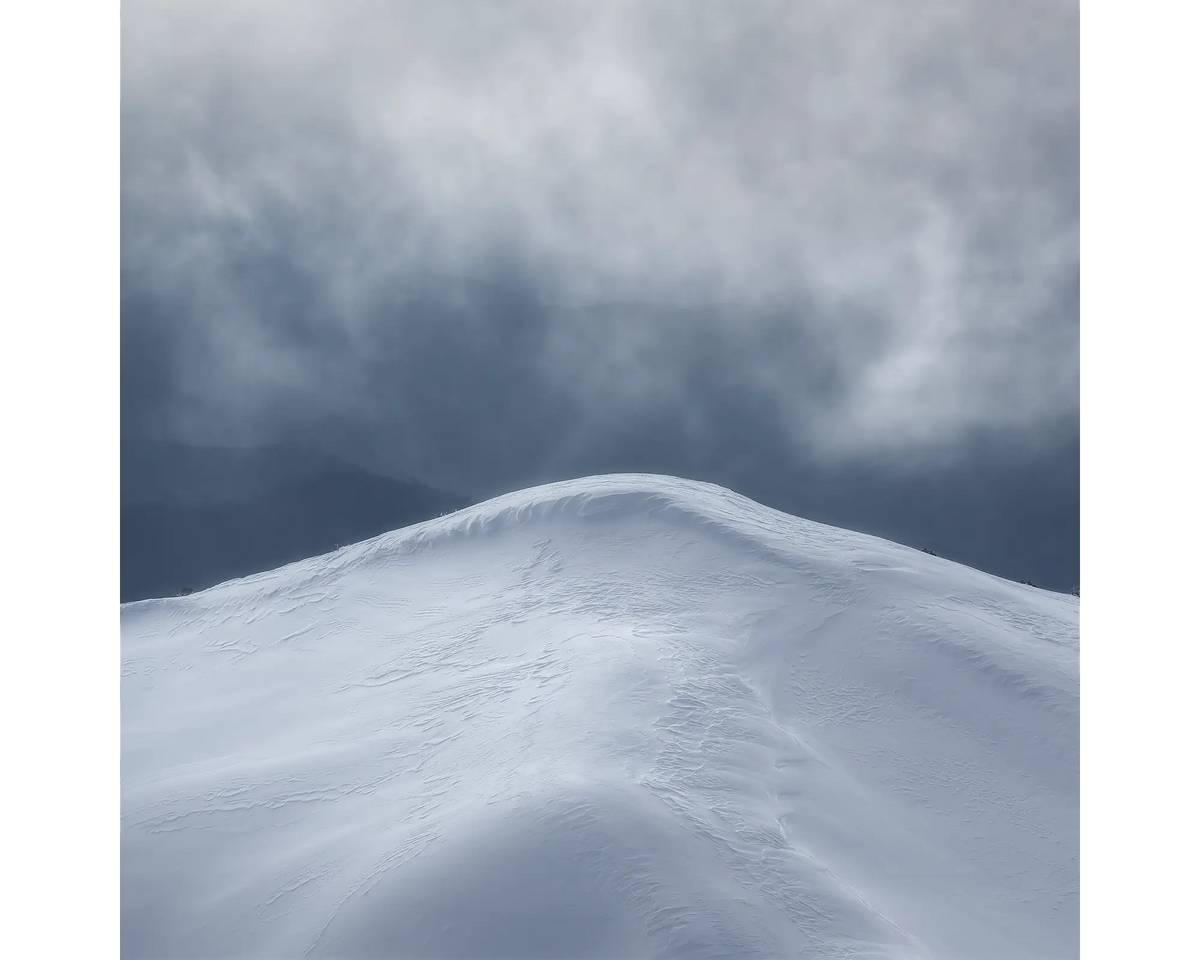 Beyond. Mountain peak with snow, Alpine National Park, Victoria, Australia.