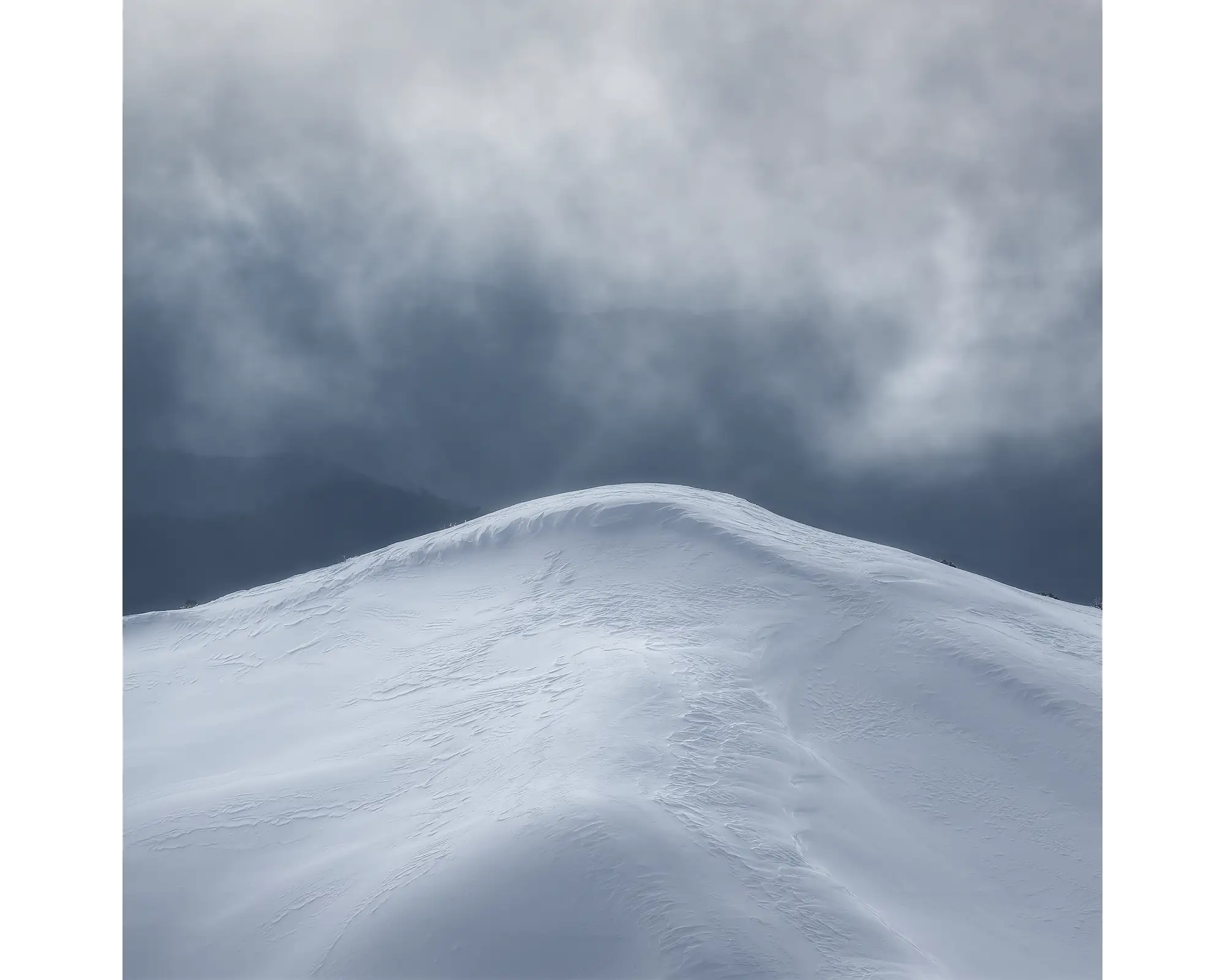 Beyond. Mountain peak with snow, Alpine National Park, Victoria, Australia.