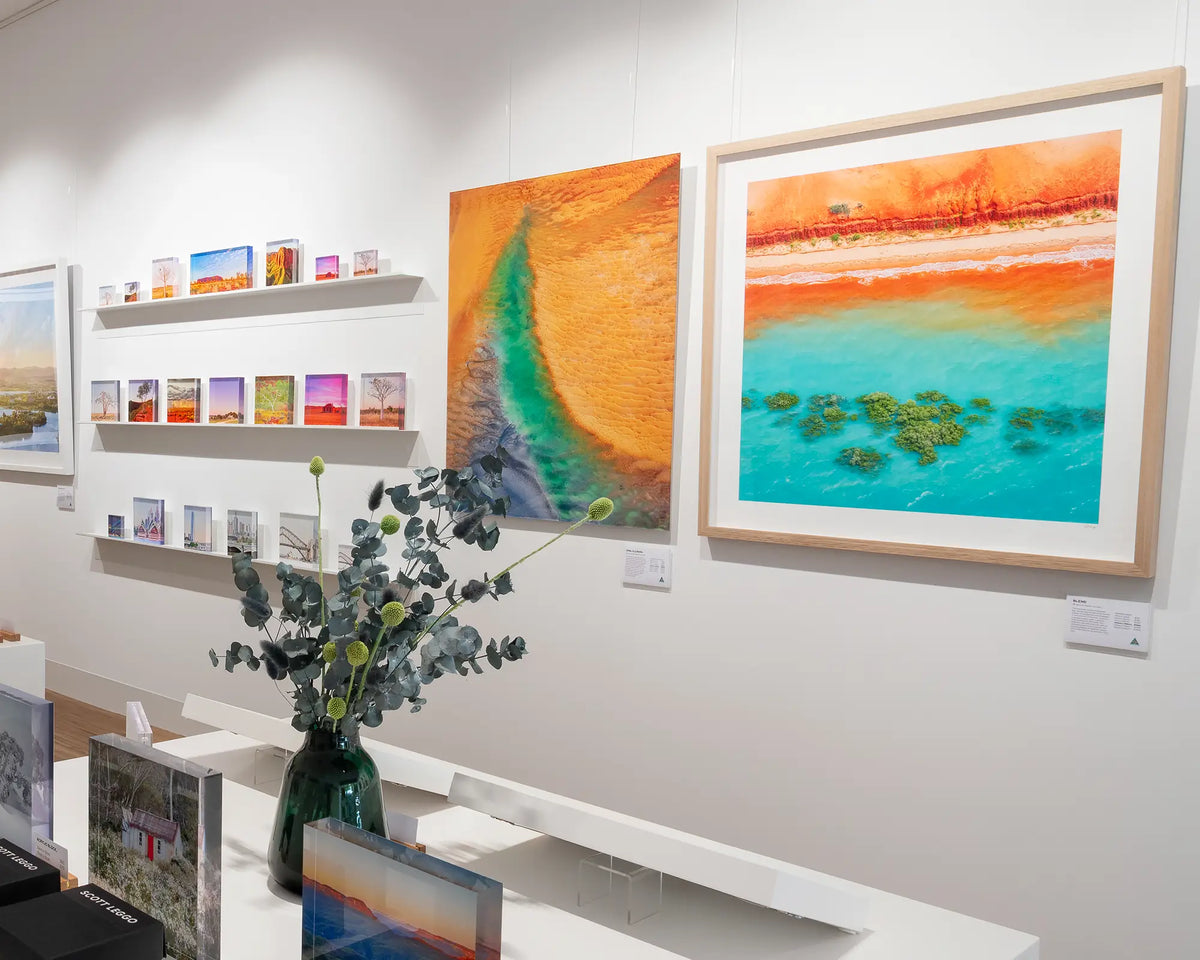 Blend. Aerial artwork The Kimberley, Western Australia, with timber frame, hung in gallery.