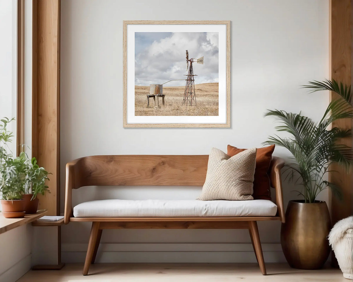 Blowing in the Wind. Timber framed, rural wall art print hung in a scandi-themed waiting area. 